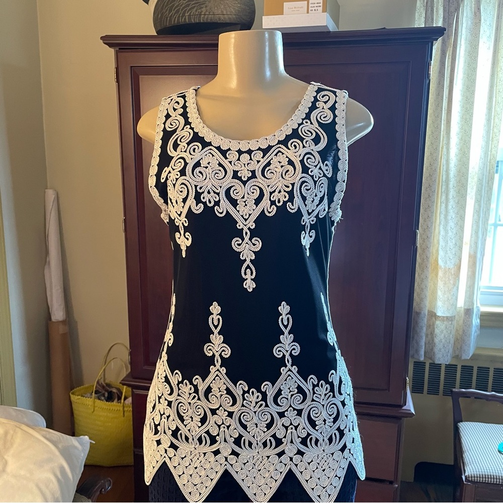 Elegant women’s top. Scalloped and embroidered details.  Black white. Stunning.